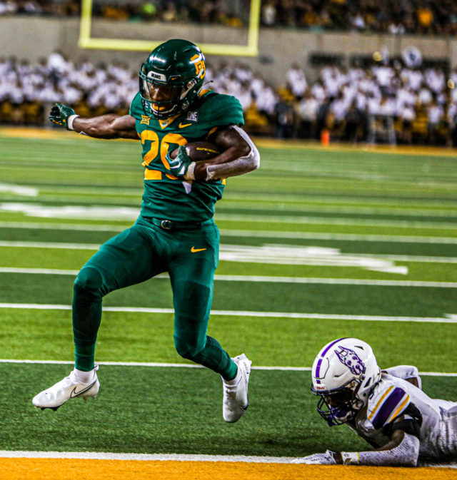Freshman running back Richard Reese escapes a University of Albany defender en route to a touchdown during a non-conference contest on Sept. 3, 2022 at McLane Stadium. 
Kenneth Prabhakar | Photographer