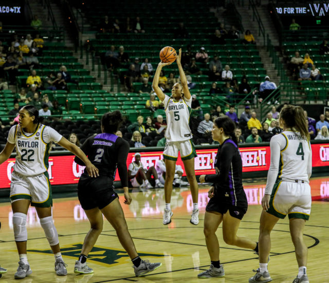 Freshman forward Darianna Littlepage-Buggs takes a jump shot from the top of the key during an exhibition game against Southwest Baptist University on Nov. 3, 2022 in the Ferrell Center.
Kenneth Prabhakar | Photographer