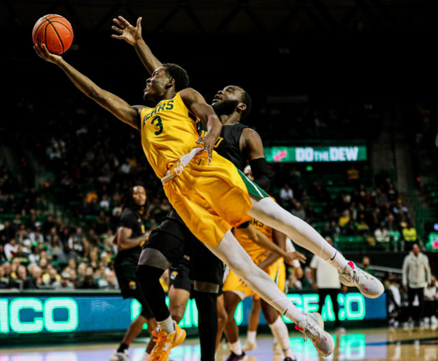 Redshirt senior guard Dale Bonner extends with his right hand for a contested layup during a non-conference game against Norfolk State University on Oct. 11, 2022 in the Ferrell Center. 
Ken Prabhakar | Photographer