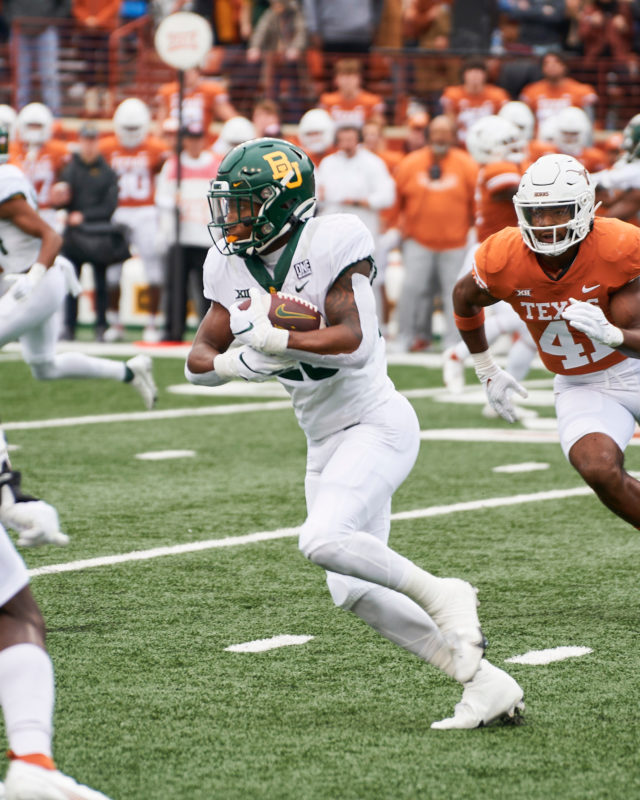 Freshman running back Richard Reese rushes up the middle during a conference game against No. 23 University of Texas on Nov. 25, 2022 at Darrell K. Royal Memorial Stadium in Austin. 
Josh McSwain | Roundup Editor-in-Chief