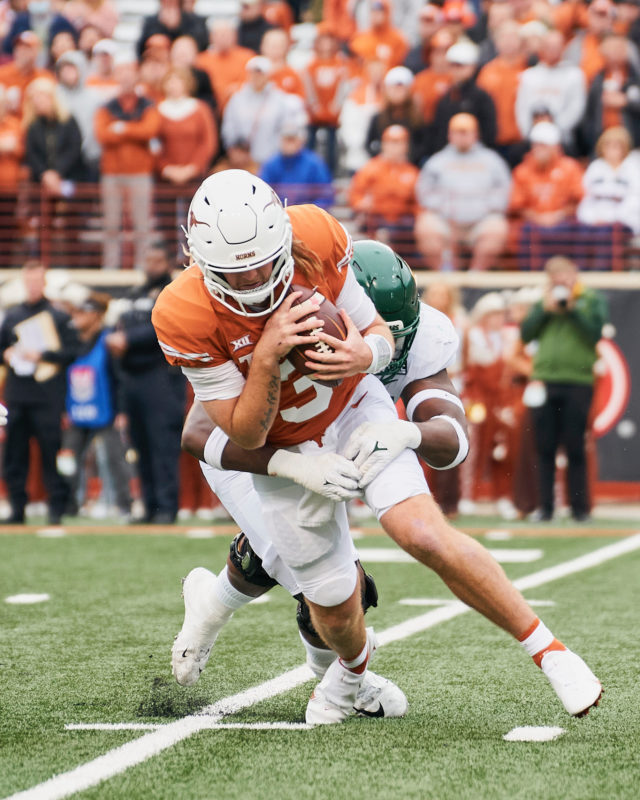 Texas' redshirt freshman quarterback Quinn Ewers (3) is sacked by junior defensive lineman Gabe Hall (95) during a conference game against No. 23 University of Texas on Nov. 25, 2022 at Darrell K. Royal Memorial Stadium in Austin. 
Josh McSwain | Roundup Editor-in-Chief
