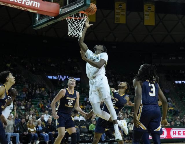 Freshman forward Josh Ojianwuna lays the ball up over the middle of the rim in a non-conference game against the University of Northern Colorado on Nov. 14, 2022 in the Ferrell Center.