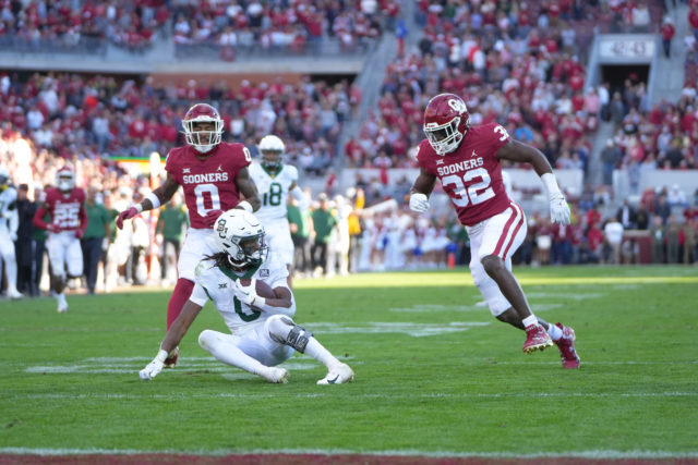 Junior running back Craig "Sqwirl" Williams makes a heads up play and falls down on his 43-yard run to ice the game during a conference contest against the University of Oklahoma on Nov. 5, 2022 at Gaylord Family Oklahoma Memorial Stadium in Norman, Okla. 
Josh Wilson | Roundup Photo Editor