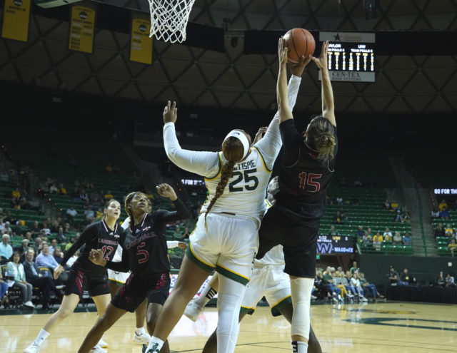 Sophomore forward Kendra Gillispie fights for a rebound during a non-conference match against the University of Incarnate Word on Nov. 18, 2022 in the Ferrell Center. 
Grace Everett | Photo Editor
