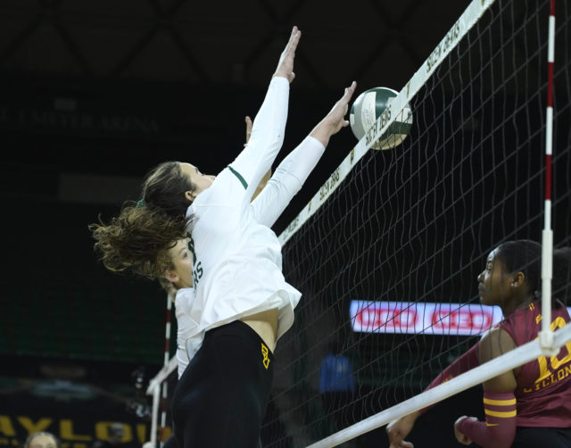 Sophomore outside hitter Elise McGhee blocks an opposing kill during a conference match against Iowa State University on Nov. 16, 2022 in the Ferrell Center.
Grace Everett | Photo Editor