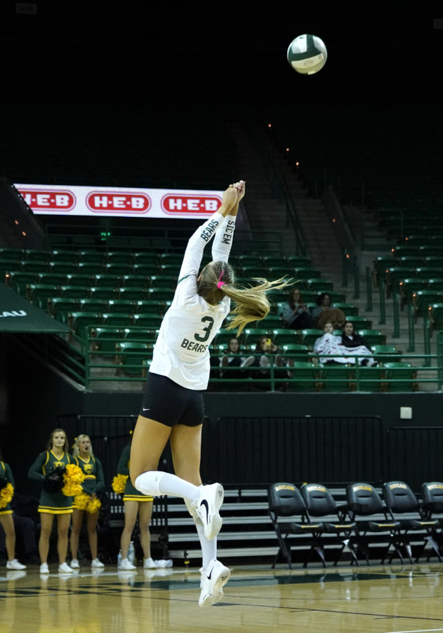 Freshman setter Averi Carlson keeps the ball in play during a conference match against Iowa State University on Nov. 16, 2022 in the Ferrell Center.
Grace Everett | Photo Editor
