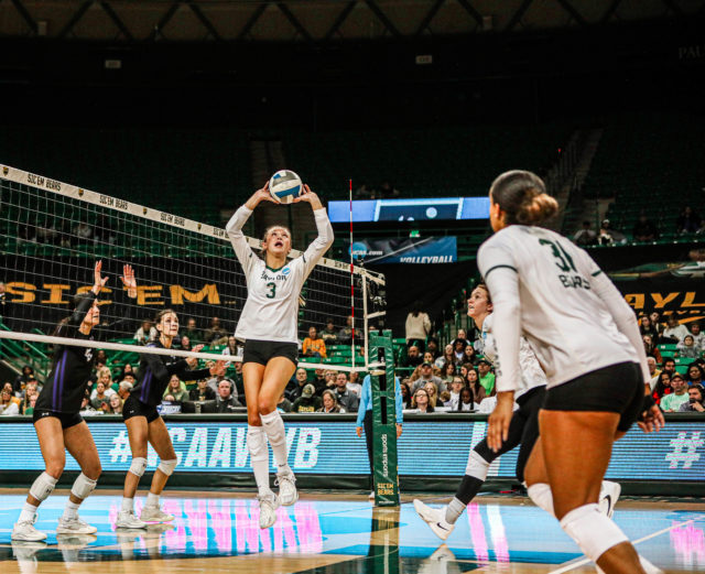 Freshman setter Averi Carlson (3) sets to her outside hitters for an attack during the 2022 NCAA Division I Volleyball Championship First Round against Stephen F. Austin State University on Dec. 1, 2022 in the Ferrell Center.
Kenneth Prabhakar | Photographer