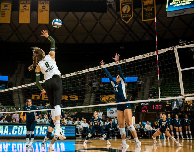 Fifth-year senior middle blocker Mallory Talbert (11) attempts an attack during a 2022 NCAA Division I Volleyball Championship Second Round match against No. 20 Rice University on Dec. 2, 2022 at the Ferrell Center. 
Kenneth Prabhakar | Photographer