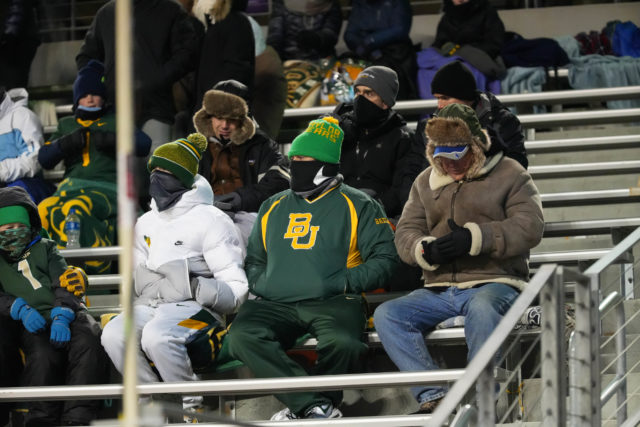 Baylor fans seated in multiple layers to fend off below freezing temperatures during the Lockheed Martin Armed Forces Bowl on Dec. 23, 2022 at Amon G. Carter Stadium in Fort Worth. 
Josh Wilson | Roundup