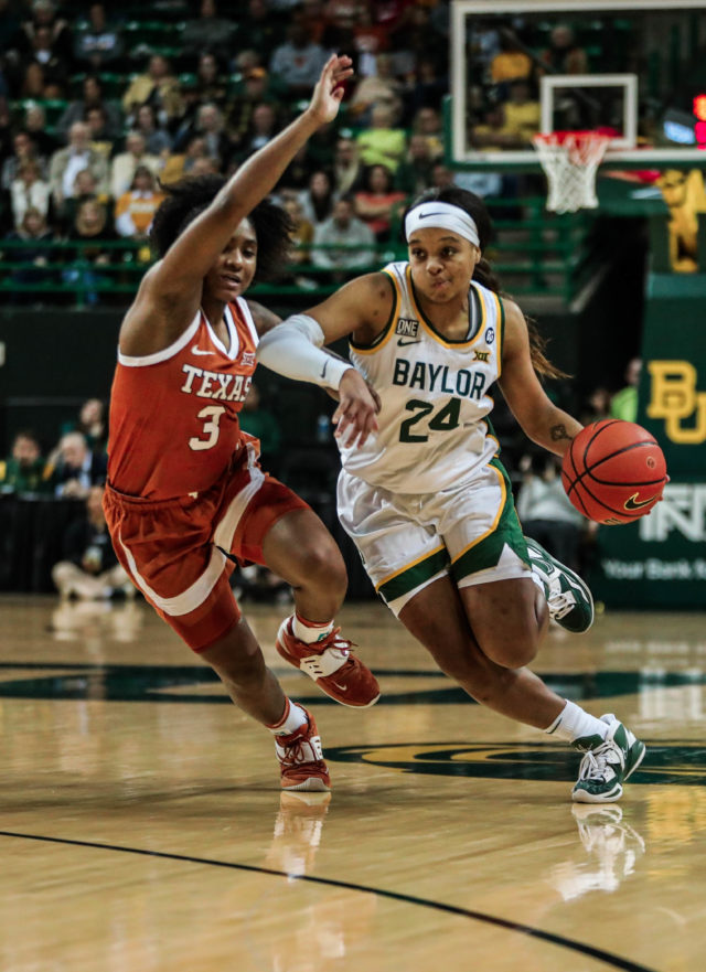 Junior guard Sarah Andrews (24) drives toward her left during a conference game against No. 25 University of Texas on Jan. 22, 2023, in the Ferrell Center.
Kenneth Prabhakar | Photo Editor