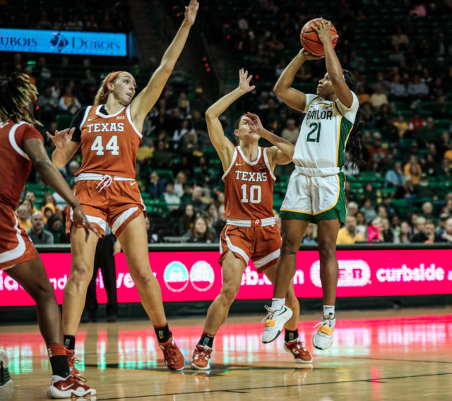 Graduate student guard Ja'Mee Asberry pulls up from just inside the free-throw line during a conference game against No. 25 University of Texas on Feb. 22, 2023 in the Ferrell Center. 
Kenneth Prabhakar | Photo Editor