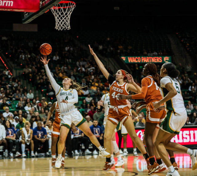 Junior guard Jana Van Gytenbeek (4) shoots a right-handed layup during a conference game against No. 25 University of Texas on Jan. 22, 2023, in the Ferrell Center.
Kenneth Prabhakar | Photo Editor