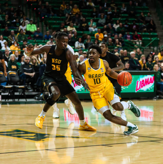 Redshirt senior guard Adam Flagler (10) drives to the left side of the hoop during a non-conference game against Norfolk State University on Nov. 11, 2022, in the Ferrell Center.
Kenneth Prabhakar | Photo Editor