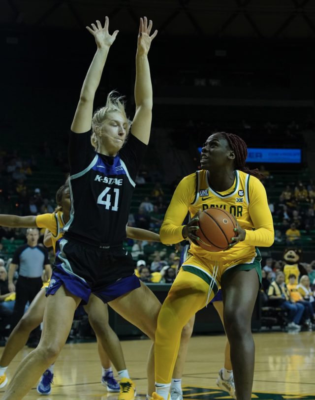 Senior forward Aijha Blackwell (33) sizes up Kansas State University's Tay Lauterbach in the paint during a conference game against Kansas State University on Jan. 19, 2023 in the Ferrell Center. 
Grace Everett | Photographer