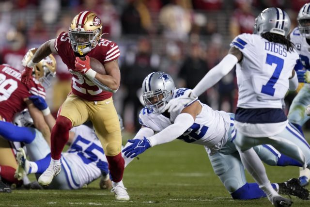 San Francisco 49ers running back Elijah Mitchell (25) runs against the Dallas Cowboys during the second half of an NFL divisional playoff football game in Santa Clara, Calif., Sunday. (AP Photo/Godofredo A. Vásquez)