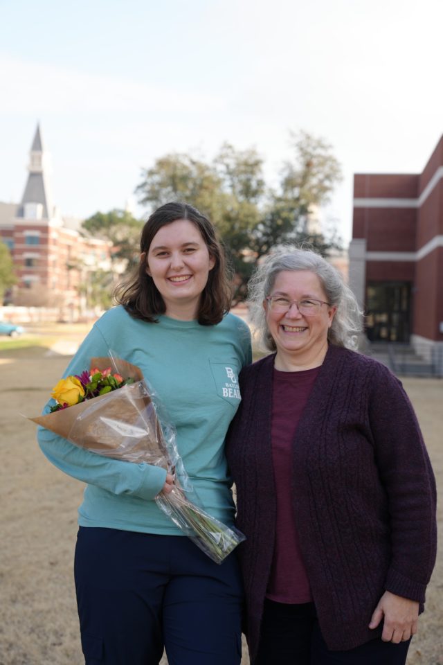Gina Gravagne and her viola professor Dr. Kathryn Steeley pose outside the Glennis McCrary Music Building after the concerto competition results are announced.