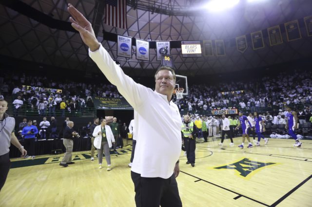 Kansas head coach Bill Self waves to fans after his team lost to Baylor in an NCAA college basketball game Monday, Jan. 23, 2023, in Waco, Texas. (AP Photo/Jerry Larson)