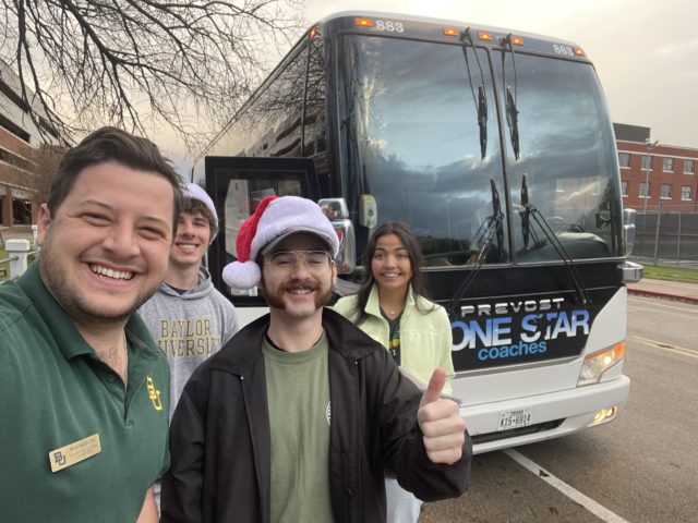 Members of the External Vice President's cabinet pose with the shuttle before its first trip. Photo courtesy of Nick Madincea.