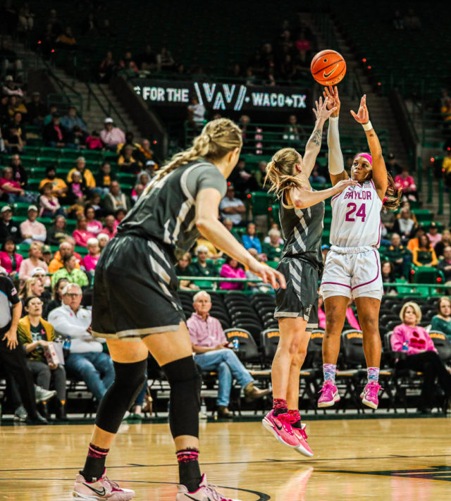 Junior guard Sarah Andrews (24) pulls up from near the top of the key during a conference game against No. 22 Iowa State University, Saturday, Feb. 18, 2023, in the Ferrell Center.
Kenneth Prabhakar | Photo Editor