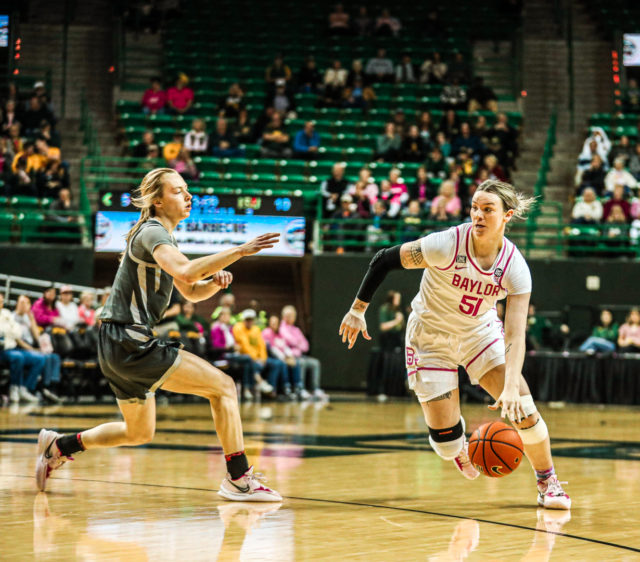 Fifth-year senior forward Caitlin Bickle (51) pushes toward the lane after a shot fake during a conference game against No. 22 Iowa State University, Saturday, Feb. 18, 2023, in the Ferrell Center.
Kenneth Prabhakar | Photo Editor
