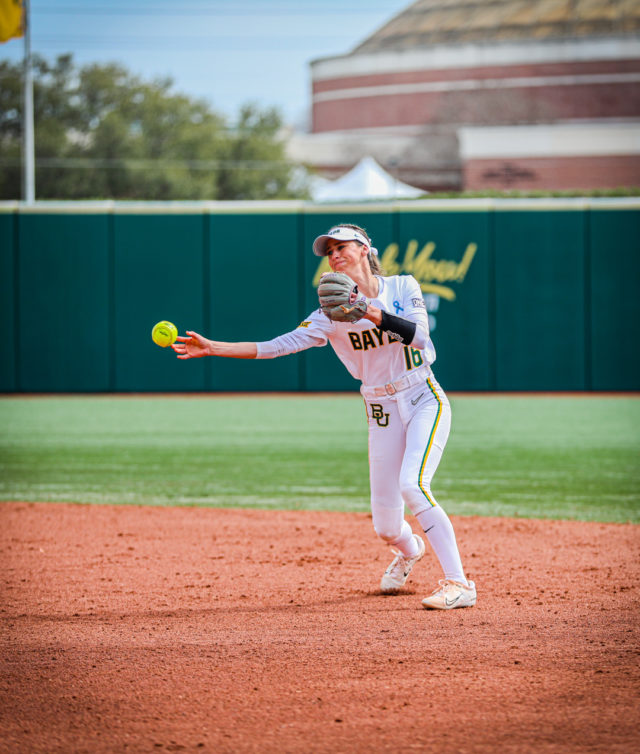 Sophomore infielder Presleigh Pilon (16) side arm throws the ball toward a teammate during a game against No. 1 University of Oklahoma as part of the Getterman Classic, Sunday, Feb. 19, 2023, at Getterman Stadium.
Kenneth Prabhakar | Photo Editor