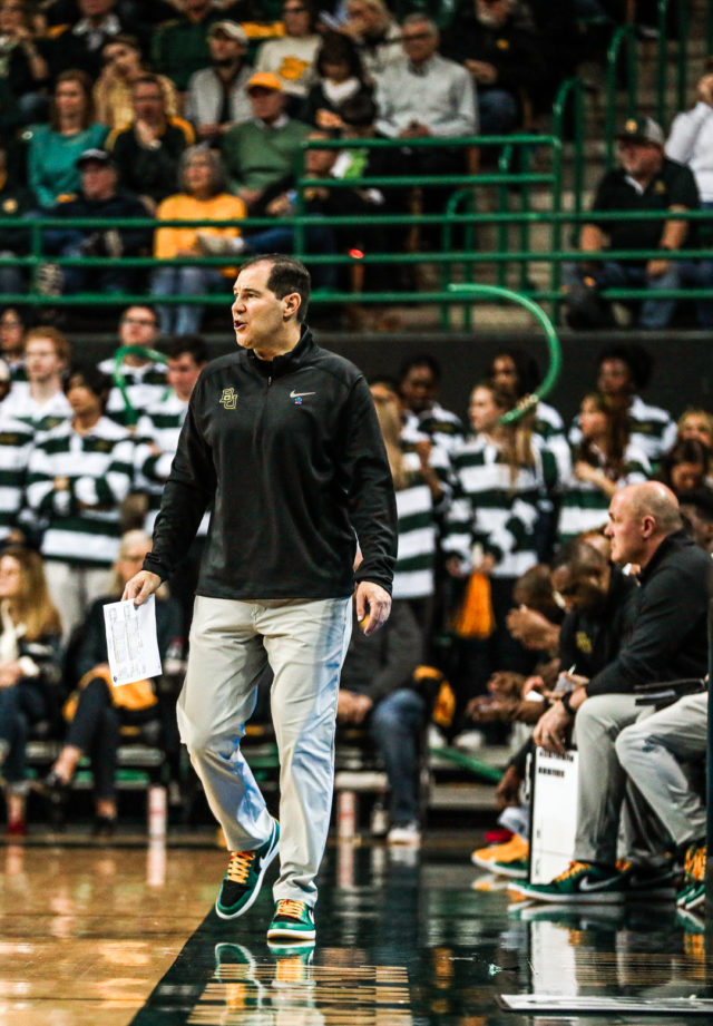 Head coach Scott Drew walks up and down the sideline during a conference game against No. 8 University of Texas, Saturday, Feb. 25, 2023, in the Ferrell Center.Kenneth Prabhakar | Photo Editor