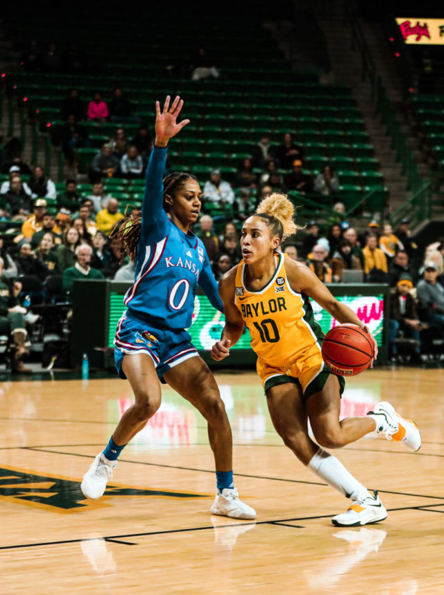 Senior guard Jaden Owens (10) drives to the basket with her left hand during a conference game against the University of Kansas on Feb. 1, 2023 in the Ferrell Center.
Kenneth Prabhakar | Photo Editor