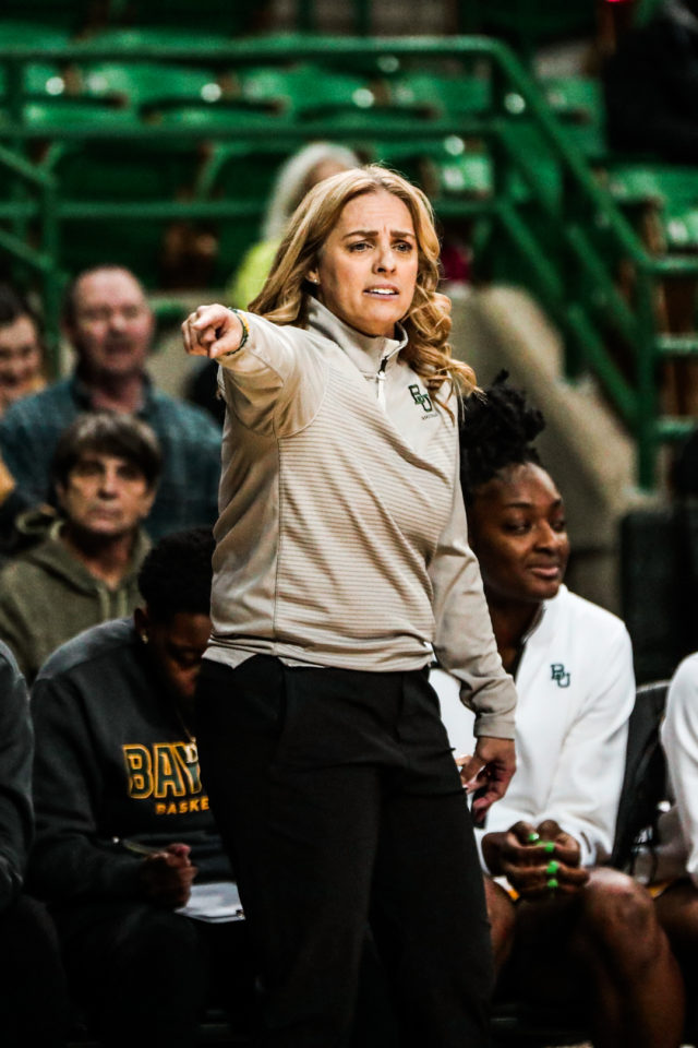 Head coach Nicki Collen points out an adjustment during a conference game against the University of Kansas on Feb. 1, 2023 in the Ferrell Center.
Kenneth Prabhakar | Photo Editor