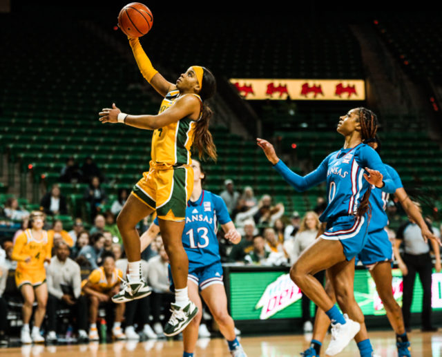 Junior guard Sarah Andrews (24) skies forward for a right handed layup during a conference game against the University of Kansas on Feb. 1, 2023 in the Ferrell Center.
Kenneth Prabhakar | Photo Editor