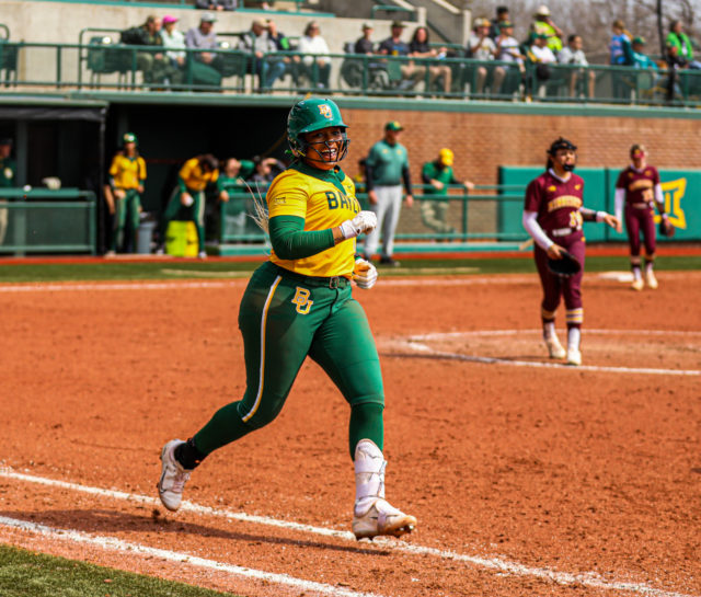 Sophomore infielder Shaylon Govan smiles as she approaches first base during the championship game of the Baylor Invitational against the University of Minnesota, Sunday, at Getterman Stadium.