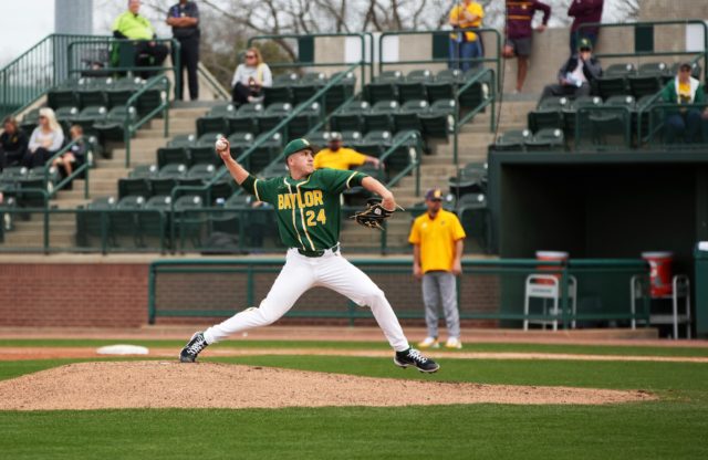 Sophomore right-handed pitcher Mason Marriott (24) lunges out and hurls a pitch toward the catcher during the final game of a non-conference series against Central Michigan Univeristy on Sunday at Baylor Ballpark. Olivia Havre | Photographer
