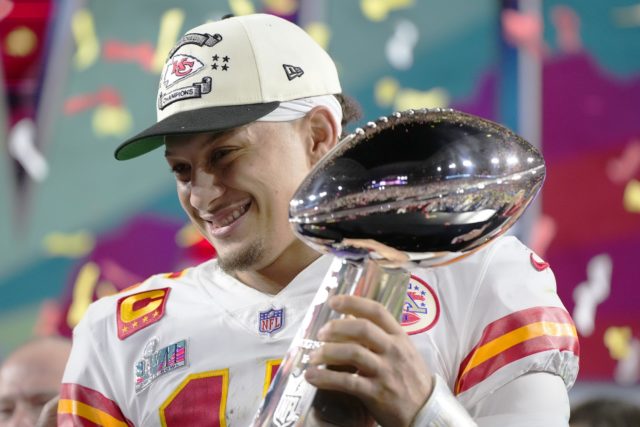 Kansas City Chiefs quarterback Patrick Mahomes (15) holds the trophy after their win against the Philadelphia Eagles in the 2023 NFL Super Bowl football game on Sunday in Glendale, Ariz. The Kansas City Chiefs defeated the Philadelphia Eagles 38-35. (AP Photo/Matt Slocum)