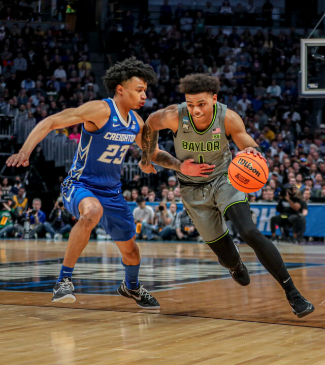 Freshman guard Keyonte George (1) tries to blow past his Bluejay defender during No. 3 seed Baylor men's basketball's NCAA Tournament second round game against No. 6 seed Creighton University, on Sunday, in the Ball Arena, in Denver.
Kenneth Prabhakar | Photo Editor