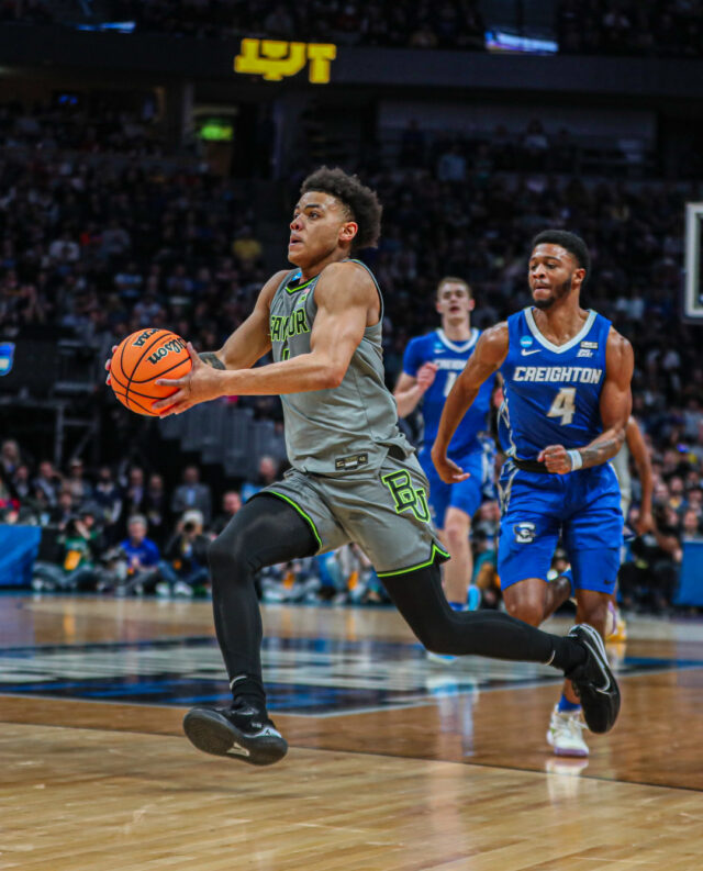 Freshman guard Keyonte George (1) gathers his dribble as he's about to jump toward the basket during No. 3 seed Baylor men's basketball's NCAA Tournament second round game against No. 6 seed Creighton University Sunday in the Ball Arena in Denver. Kenneth Prabhakar | Photo Editor