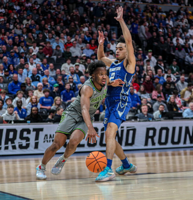 Junior guard LJ Cryer (4) drives down the right baseline during No. 3 seed Baylor men's basketball's NCAA Tournament second round game against No. 6 seed Creighton University, on Sunday, in the Ball Arena, in Denver.
Kenneth Prabhakar | Photo Editor