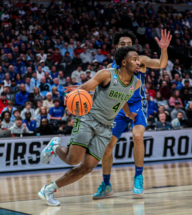 Junior guard LJ Cryer (4) looks over his options near the baseline during No. 3 seed Baylor men's basketball's NCAA Tournament second round game against No. 6 seed Creighton University Sunday in the Ball Arena in Denver. Kenneth Prabhakar | Photo Editor