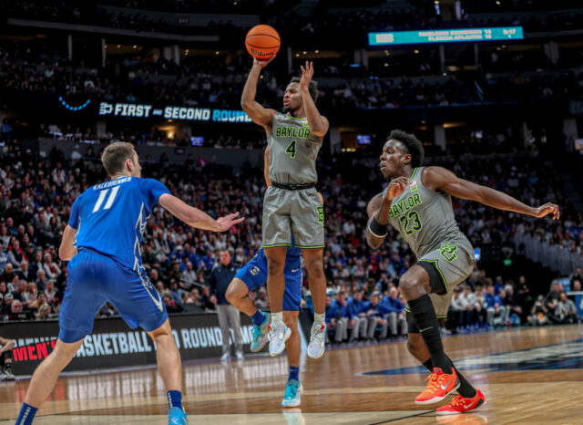 Junior guard LJ Cryer (4) shoots a floater off the pick-and-roll during No. 3 seed Baylor men's basketball's NCAA Tournament second round game against No. 6 Creighton University, on Sunday, in the Ball Arena, in Denver.
Kenneth Prabhakar | Photo Editor