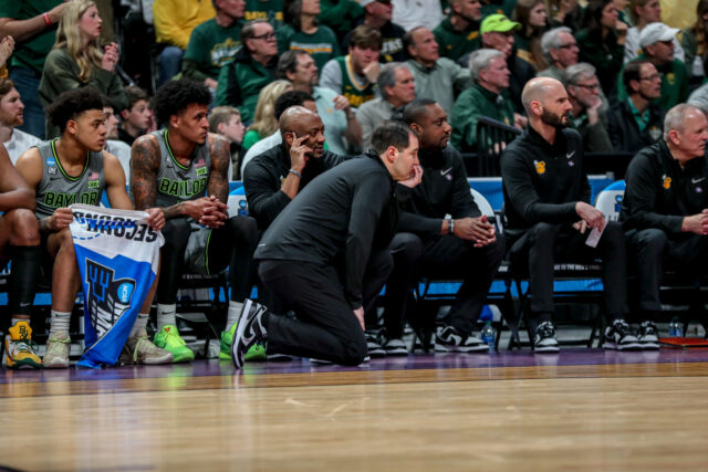 Head coach Scott Drew kneels down and looks on with the team bench during No. 3 seed Baylor men's basketball's NCAA Tournament second round game against No. 6 Creighton University, on Sunday, in the Ball Arena, in Denver.
Kenneth Prabhakar | Photo Editor