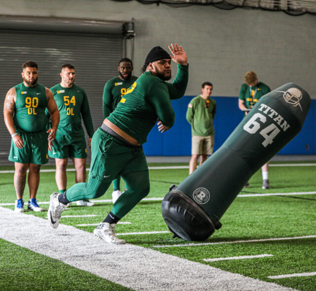 Defensive lineman Siaki "Apu" Ika (62) utilizes a swim move to get past the inflatable dummy during Baylor football&squot;s Pro Day, on Monday, in Midway&squot;s Activity Center, in Hewitt.
Kenneth Prabhakar | Photo Editor