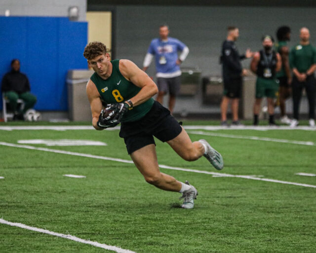 Tight end Ben Sims (8) hauls in the pass and explodes off his right foot during Baylor football's Pro Day, on Monday, in Midway's Activity Center, in Hewitt.
Kenneth Prabhakar | Photo Editor