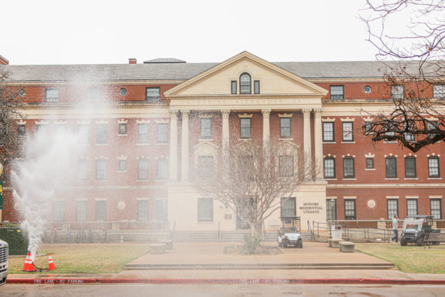 Water shoots out of a pipe in front of Alexander Hall. Kenneth Prabhakar | Photo Editor