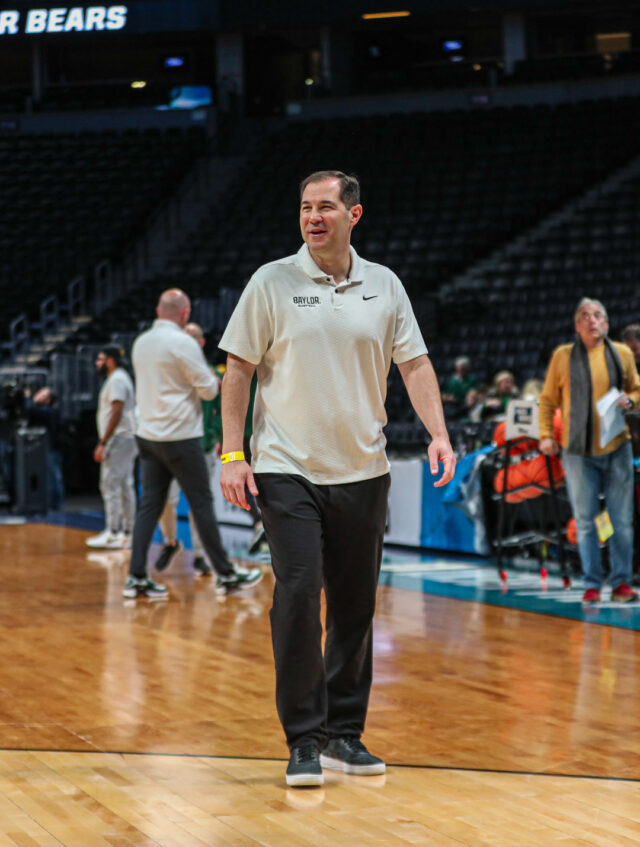 Head coach Scott Drew smiles as he makes his way across the court during No. 3 seed Baylor men's basketball's team practice ahead of its round of 64 contest against the University of California, Santa Barbara, on Thursday, in the Ball Arena, in Denver. 
Kenneth Prabhakar | Photo Editor