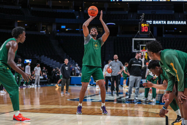 Fifth-year senior forward Flo Thamba (0) smiles as he takes a free throw during No. 3 seed Baylor men's basketball's team practice ahead of its round of 64 contest against the University of California, Santa Barbara, on Thursday, in the Ball Arena, in Denver. 
Kenneth Prabhakar | Photo Editor