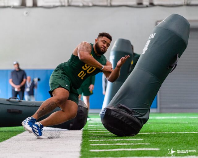 Defensive lineman Jaxon Player (90) explodes through the final inflatable dummy during Baylor football's Pro Day, on Monday, in Midway's Activity Center, in Hewitt.
Photo courtesy of Baylor Athletics