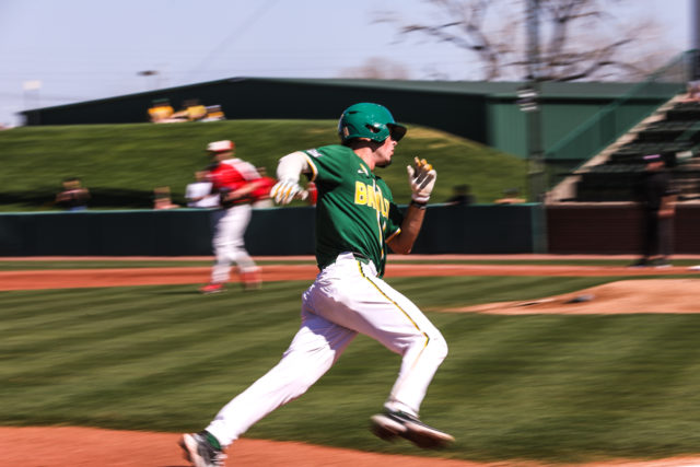 Baylor player, FenderGrass, rushes to home base to give Baylor their lead vs Youngstown State University. Assoah Ndomo | Photographer.