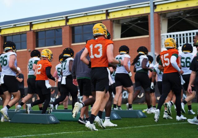 Redshirt sophomore quarterback Sawyer Robertson (13) runs with the group toward the sideline during Baylor football's second day of spring camp, on Thursday, on the team's practice field.
Olivia Havre | Photographer