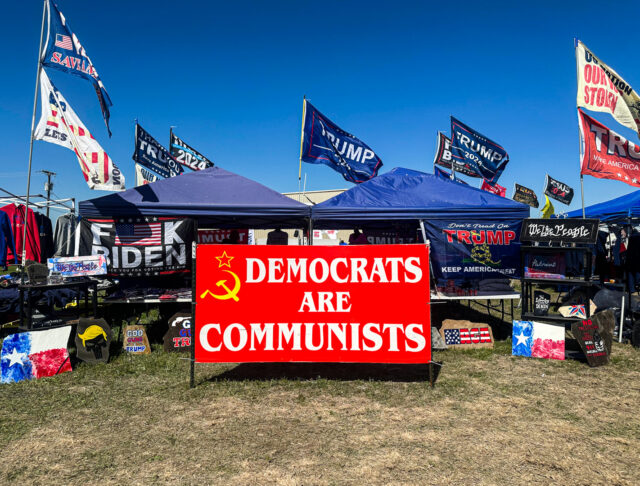 Dozens of Trump supporters were selling merchandise at the front of the line to enter the venue, where they sold flags, signs, hats and shirts to attendees. Kenneth Prabhakar | Photo Editor