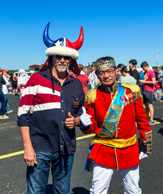 Two Trump supporters dress up for the rally in excitement for the former president's first campaign stop in Waco Saturday. Kenneth Prabhakar | Photo Editor