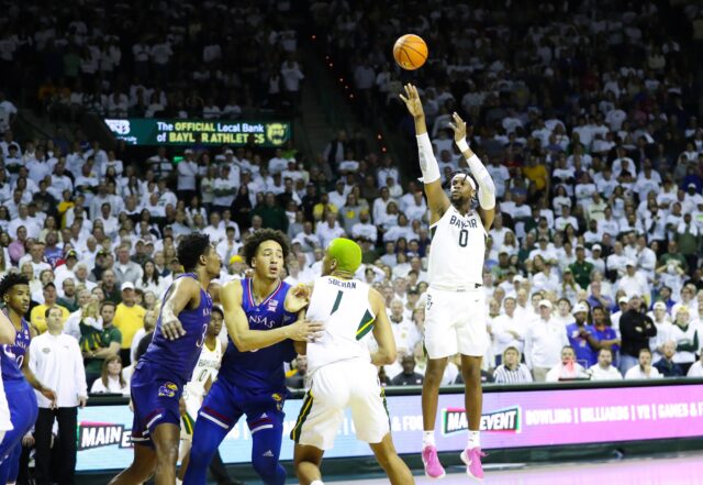 Senior forward Flo Thamba (0) shoots a jump shot during a conference game against No. 5 University of Kansas, on Feb. 26, 2022, in the Ferrell Center.
Lariat file photo