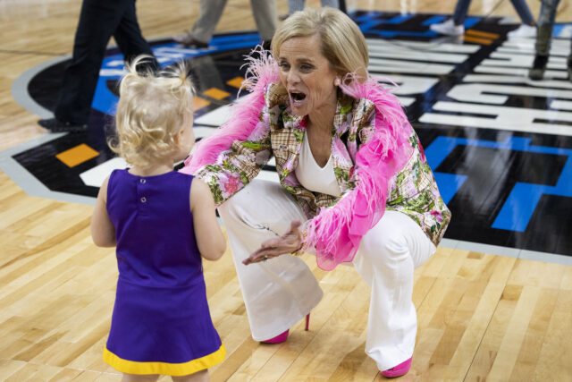 LSU coach Kim Mulkey greets a young person after LSU defeated Utah in a Sweet 16 college basketball game in the women's NCAA Tournament in Greenville, S.C., Friday. (AP Photo/Mic Smith)